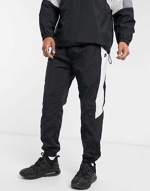 Nike color block woven cuffed sweatpants in black | ASOS