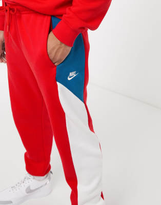 red nike trackies