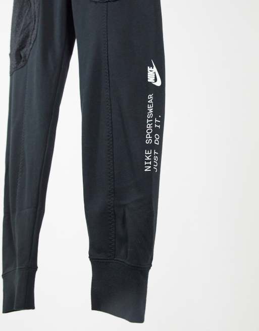 Nike concrete jungle pack woven cuffed joggers in black new arrivals