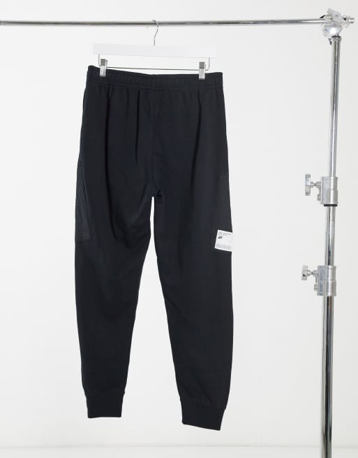 Nike Concrete Jungle Pack cuffed utility joggers in black ASOS