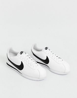 white nike sneakers with black swoosh