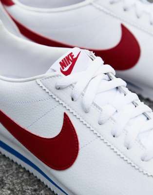 white nike shoe with red swoosh