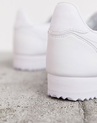 nike triple white leather cortez trainers