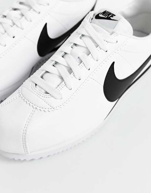 Nike cortez leather trainers in white 2025 with black swoosh