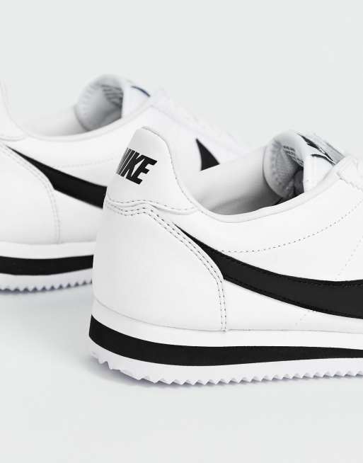 Nike cortez leather trainers in white 2025 with black swoosh