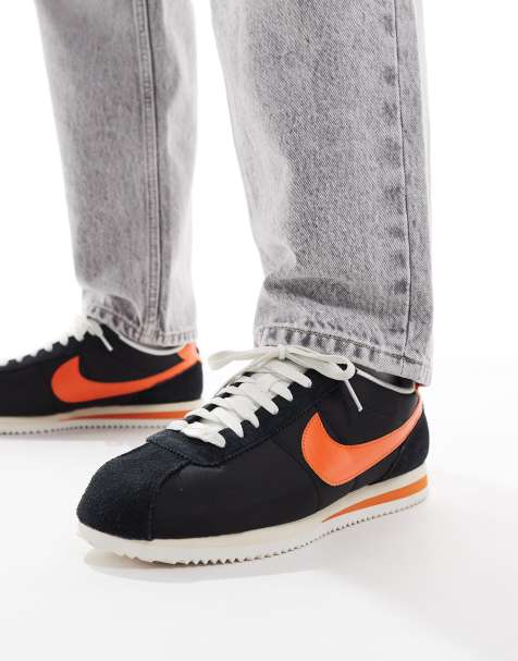 Nike Cortez sneakers in black and orange - view 1