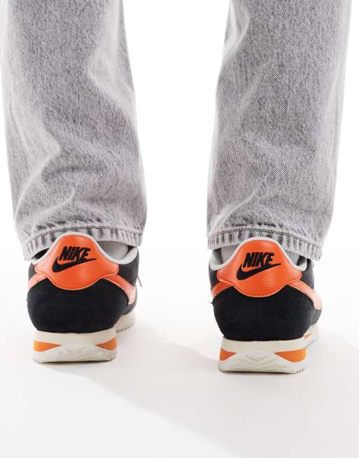Nike Cortez sneakers in black and orange, 3 of 5