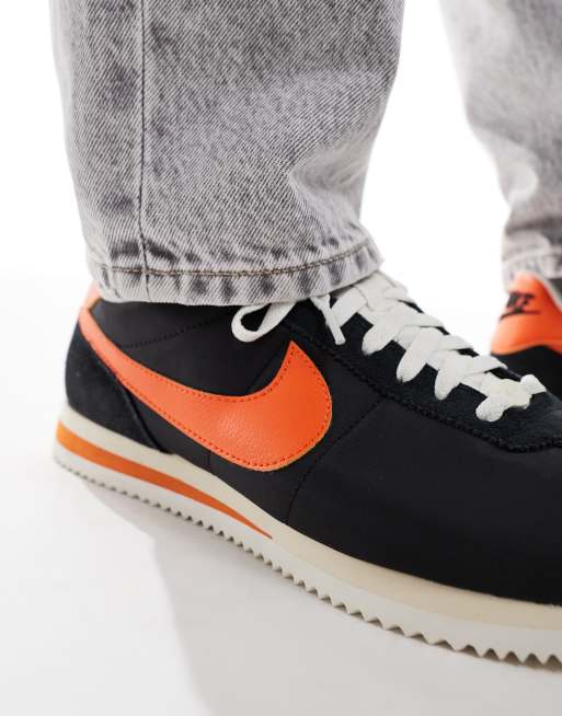 Nike Cortez sneakers in black and orange ASOS