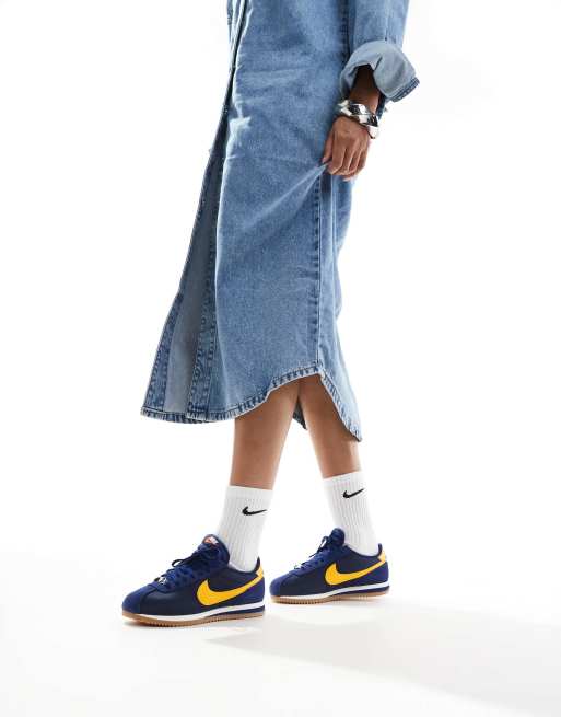 Nike Cortez sneakers in navy and yellow