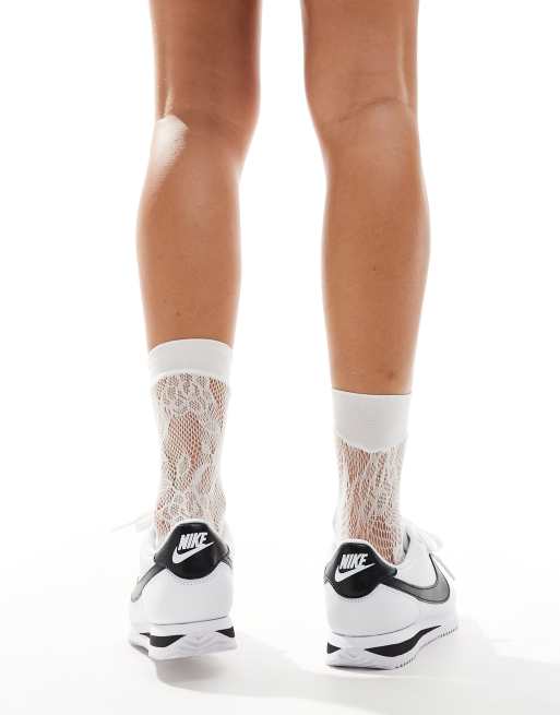 Nike Cortez sneakers in white and black, 2 of 5
