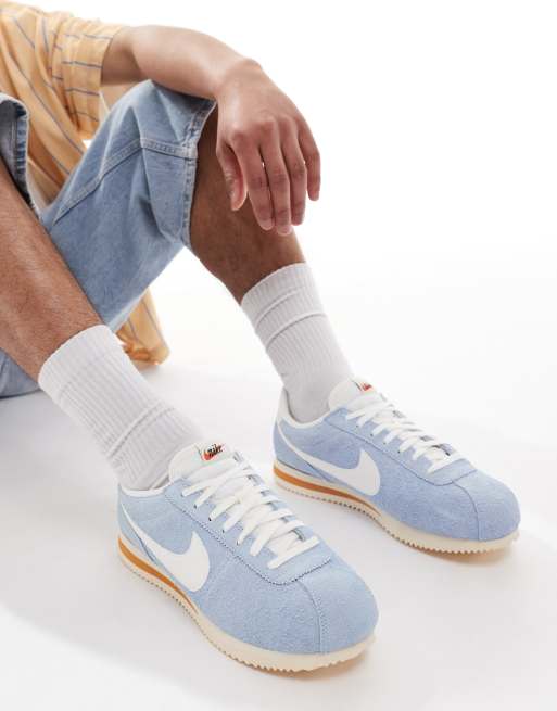 Nike Cortez suede sneakers in light blue and white