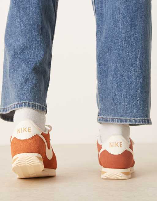 Nike Cortez suede sneakers in orange and white