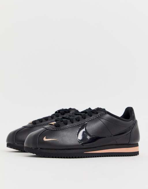 Nike Cortez trainers in black and rose gold