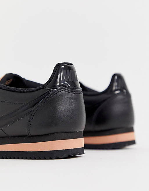 Nike Cortez trainers in black and rose gold