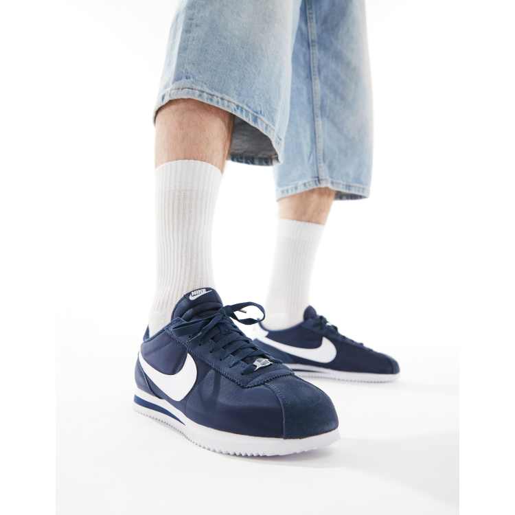 Navy blue and white cortez on sale