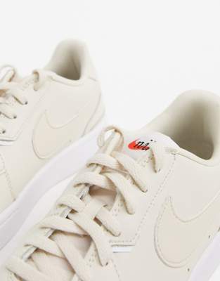 cream nike sneakers