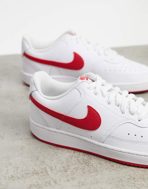 Nike white trainers store with red tick