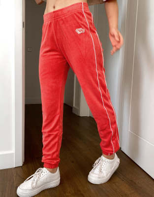 red nike trackies