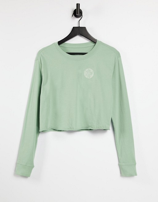 Nike cropped long sleeve t-shirt in light green with back print