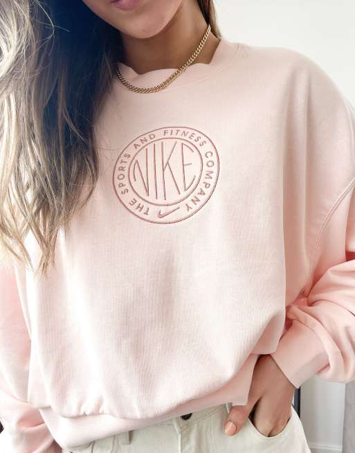 Nike cropped sweatshirt in baby pink with chest print logo