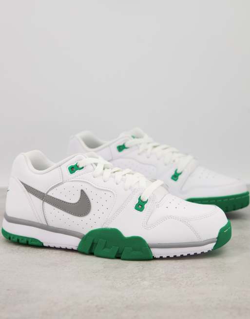 white and green nike trainers