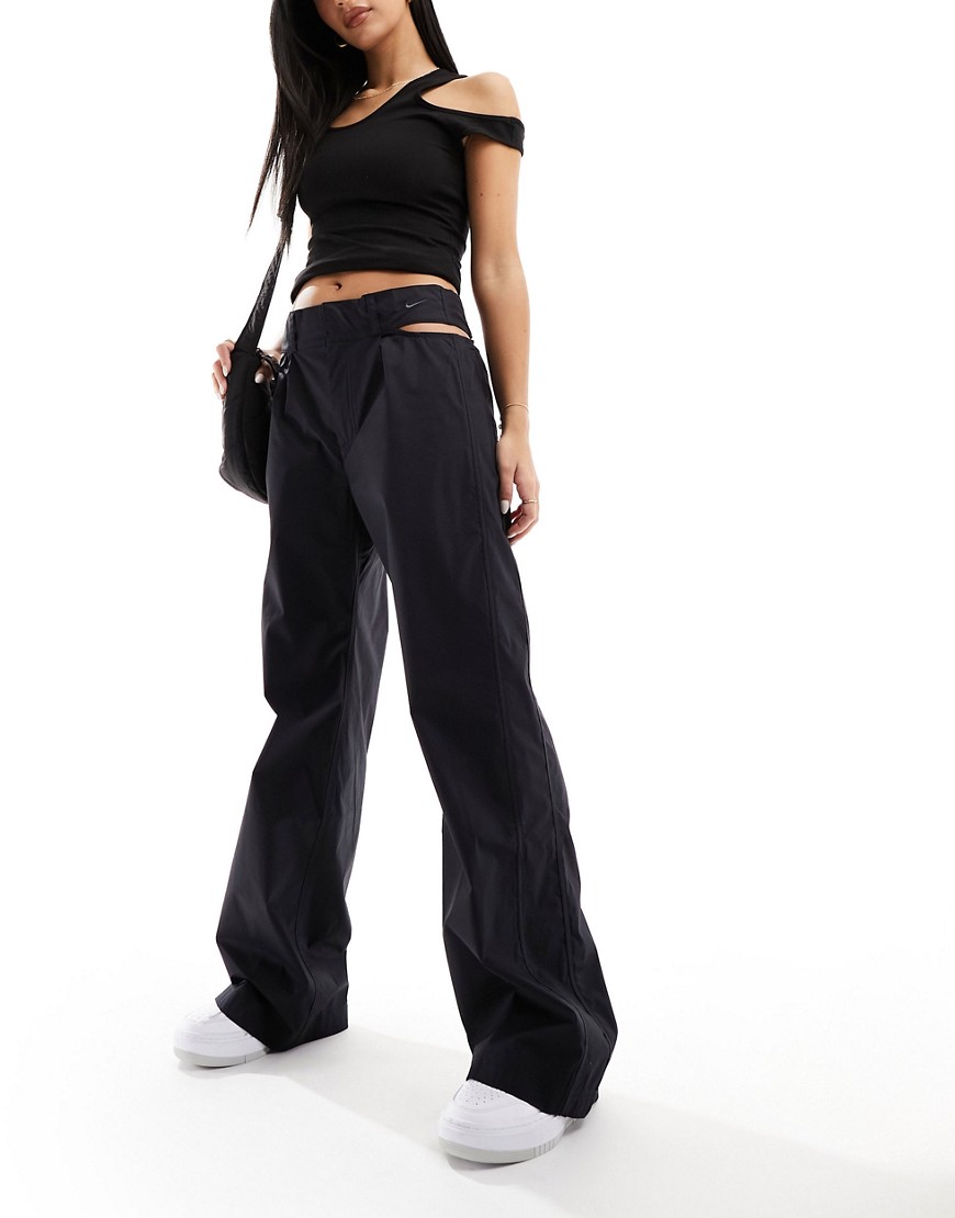 Nike cut out waist woven baggy trousers in black