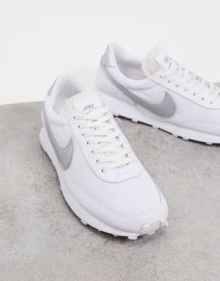 white and silver nike trainers