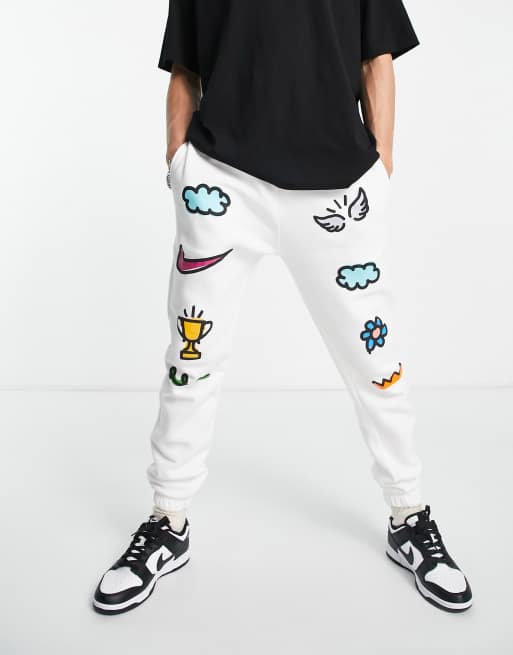 Nike Doodleglyph graphic cuffed sweatpants in white - WHITE