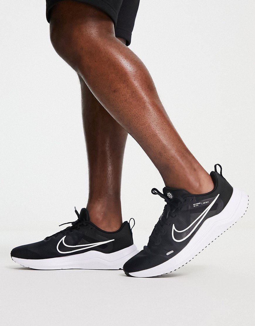 Nike Downshifter 12 sneakers in black & white