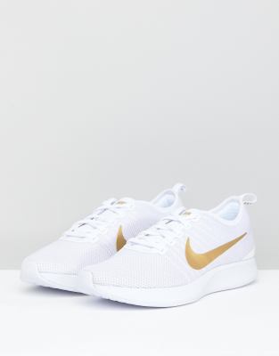 white and gold nike trainers