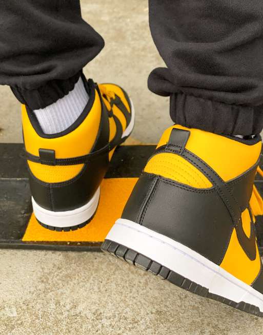 This Nike Dunk High Is Dressed In University Gold Black