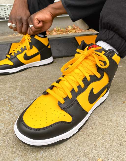 This Nike Dunk High Is Dressed In University Gold Black