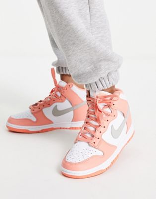 Nike Dunk High trainers in white and crimson bliss pink