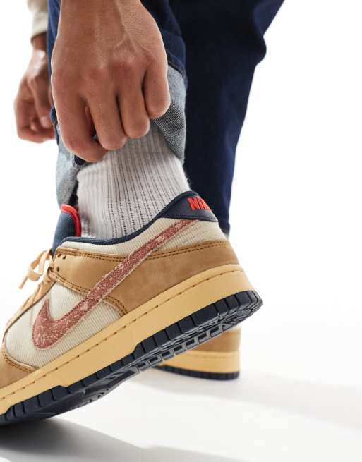 Nike Dunk Low Retro sneakers in beige and orange