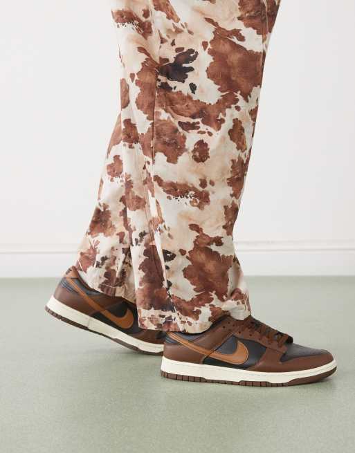 Nike Dunk Low retro sneakers in brown and black