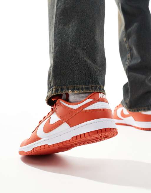 Nike Dunk Low Retro sneakers in white and orange ASOS