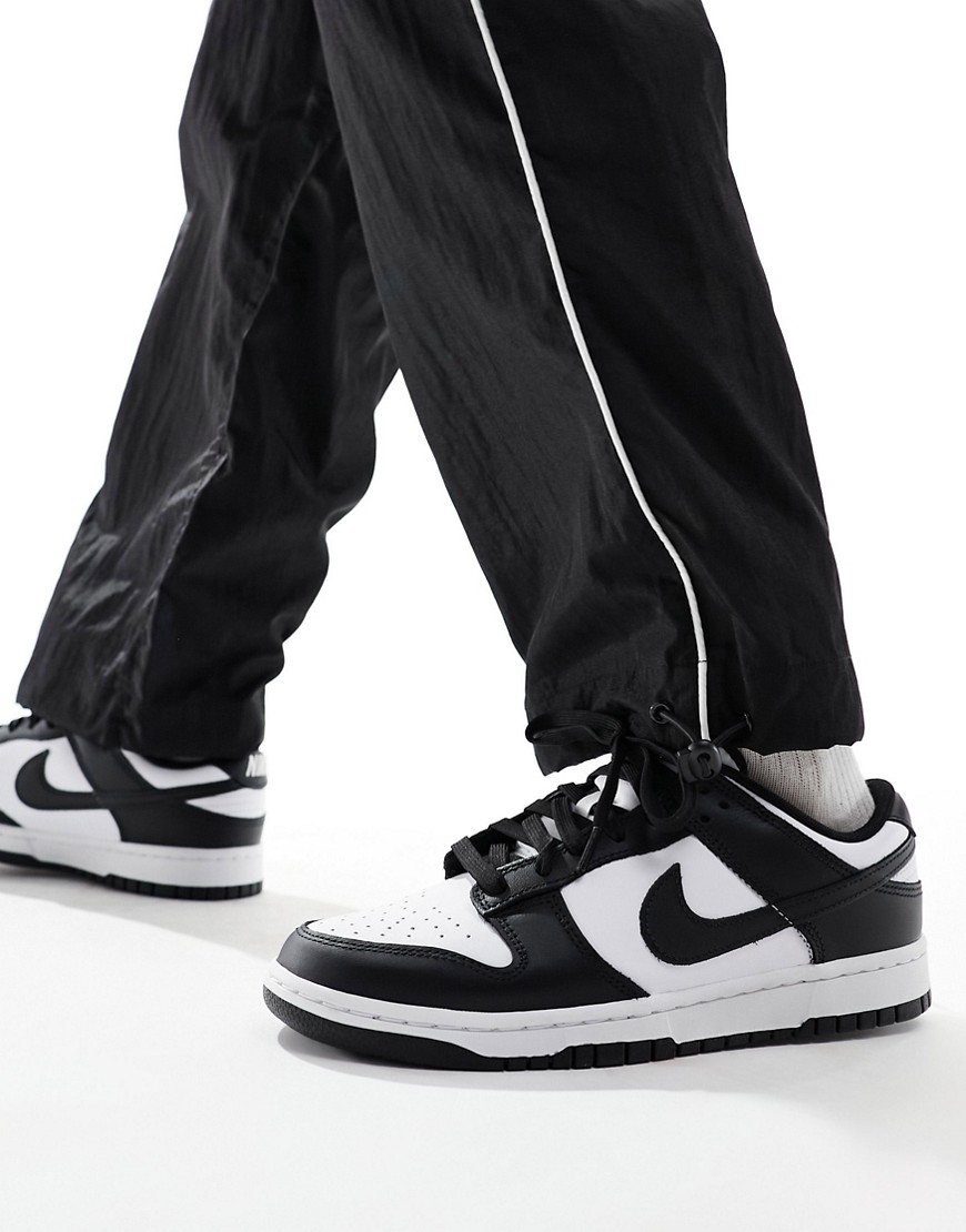 Shop Nike Dunk Low Retro Sneakers In Black And White