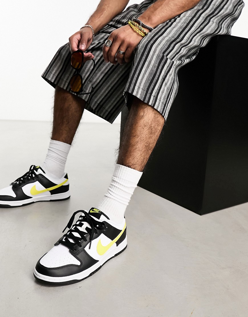 Nike Dunk Low retro trainers in black and yellow