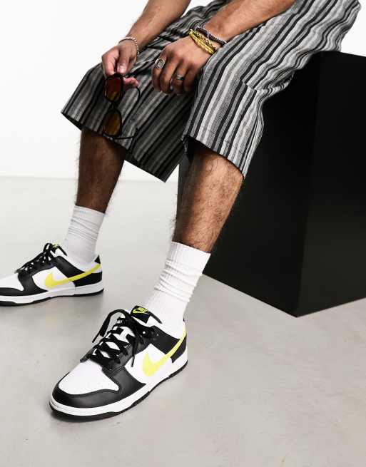 Nike Dunk Low retro trainers in black and yellow | ASOS