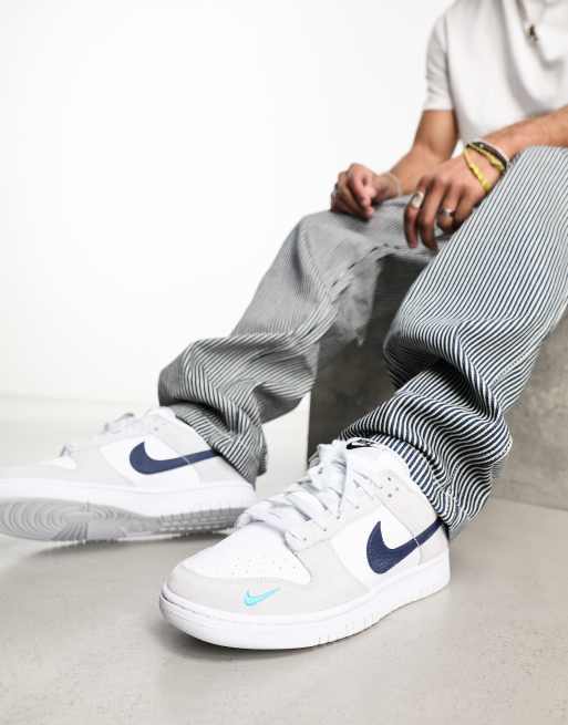 Nike Dunk Low Retro trainers in white and blue