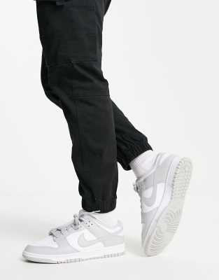 Nike Dunk Low Retro Trainers In White And Grey