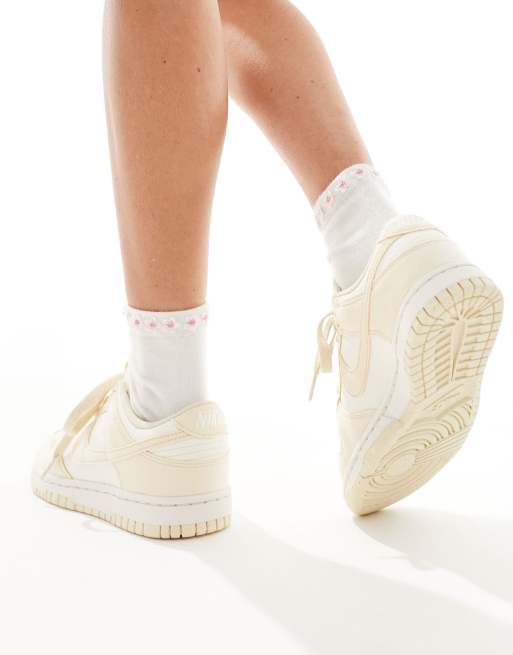 Nike Dunk Low sneakers in white and beige