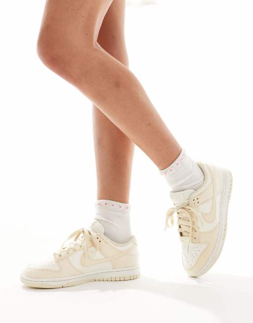 Nike Dunk Low sneakers in white and beige