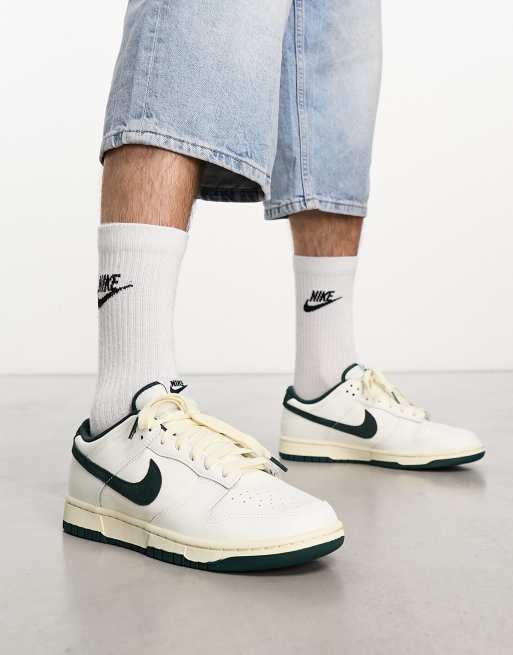 Nike Dunk Low trainers in off white and dark green