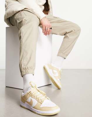 Nike Dunk Low trainers in white and gold | ASOS