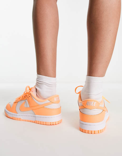 Nike Dunk Low trainers in white and peach cream ASOS