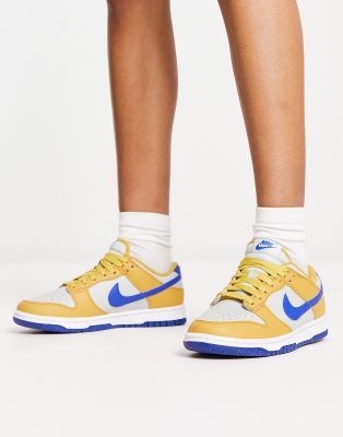 Nike - Dunk Next - Sneaker in Gold und Königsblau-Goldfarben