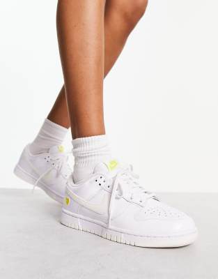 Nike white and outlet yellow trainers