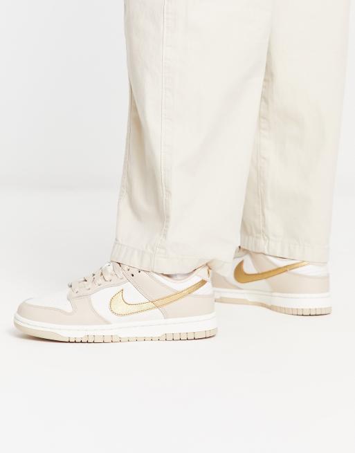 Nike Dunk trainers in stone and gold