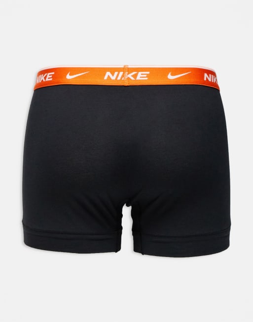Nike Essential Cotton 3 pack trunks in black with orange/red/grey waistbands, 2 of 3